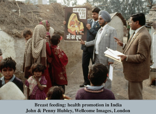 John & Penny Hubley, Wellcome Images, London Breast feeding: health promotion . In this urban slum in India, a poster on mother and child health and breast feeding is being tested. Ideally, health education programms should start with trials in small groups before wider implementation. Second half 20th century